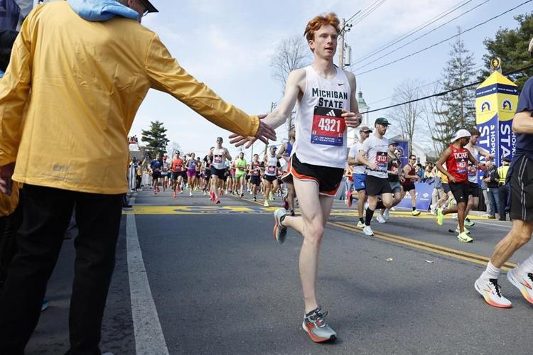 Ethiopia's Sisay Lemma wins Boston Marathon in runaway. Kenya's Hellen Obiri repeats in women's race