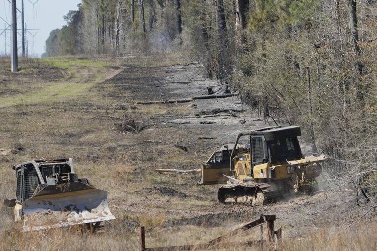 Texas wildfire prompts evacuations as Arkansas and Florida also battle blazes