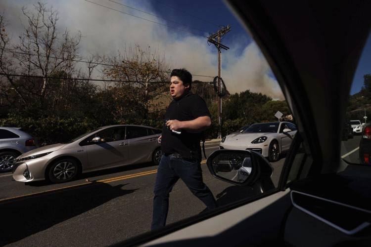 Homes were burning and roads already jammed when Pacific Palisades evacuation order came, AP finds