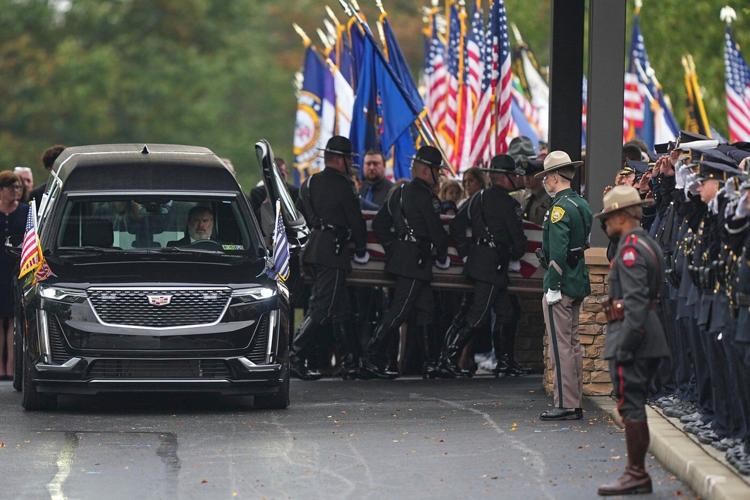 Police gather for the funeral of 3 Pennsylvania detectives ambushed by gunman