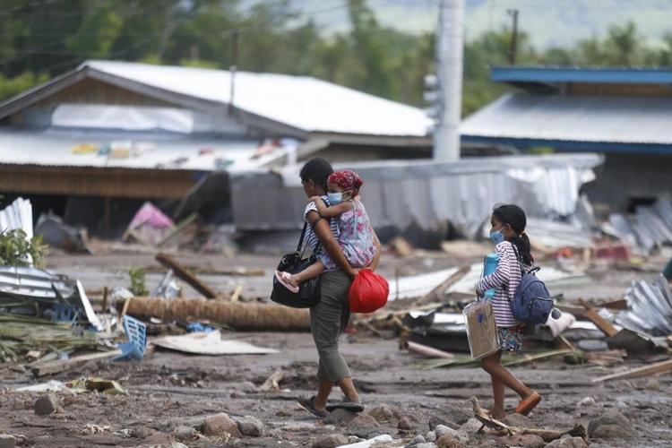 Nearly 100 dead, dozens missing in storm-ravaged Philippines