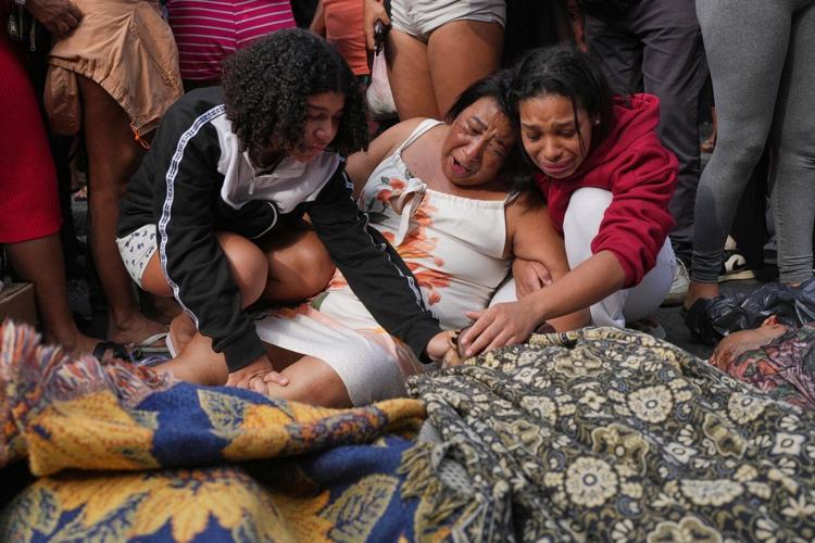 Anguish in Rio: Photos show bodies lining the streets after massive police raid