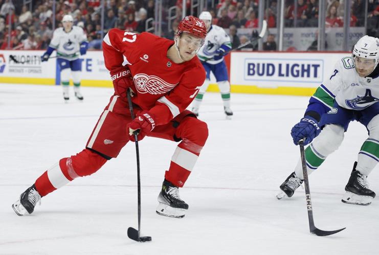 Jake DeBrusk scores hat trick, including OT game-winner, as Canucks top Red Wings 5-4