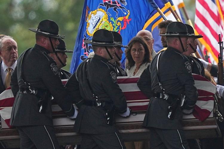 Police gather for the funeral of 3 Pennsylvania detectives ambushed by gunman
