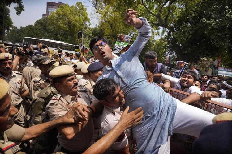 Opposition parties disrupt India's Parliament for 2nd day to protest ethnic violence in northeast
