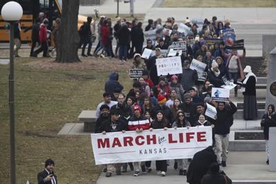 Kansas’ top court bolsters a state right to abortion and strikes down 2 anti-abortion laws