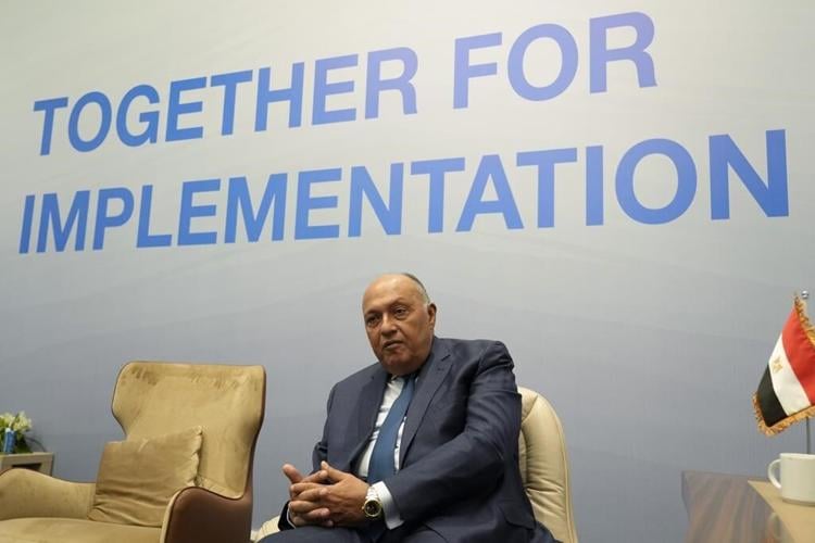 Drinks at Egypt climate talks now free, jailed activist not