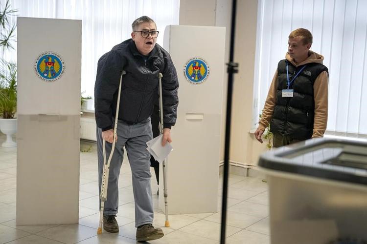 Moldovans cast votes to choose president and decide on EU path as Russian interference claims spike