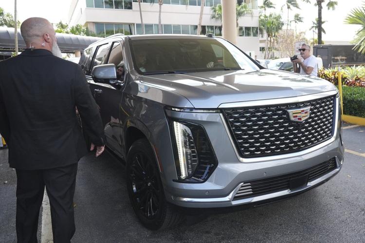 Influencer Tate brothers, who face human trafficking charges in Romania, arrive in the US