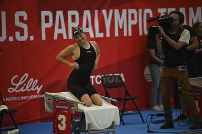 While Simone Biles competes across town, Paralympic star Jessica Long rolls at swimming trials