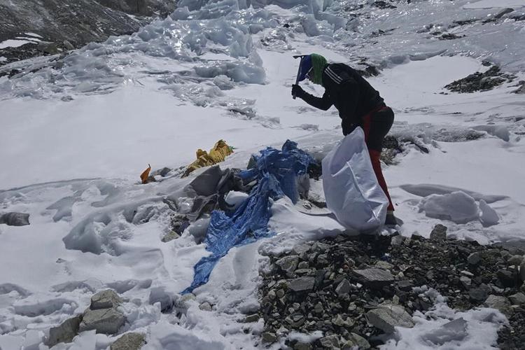 Mount Everest's highest camp is littered with frozen garbage, and cleanup is likely to take years