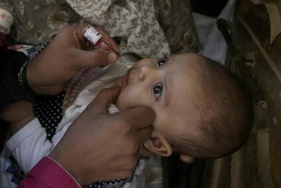 Pakistan says gunmen killed policeman guarding polio workers