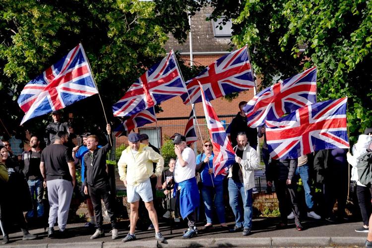 UK leaders call for calm as protests break out after Belfast street stabbing
