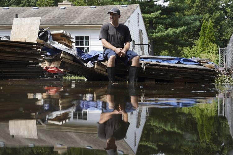 At least 6 people have died from days of storms and record-setting flooding in Indiana
