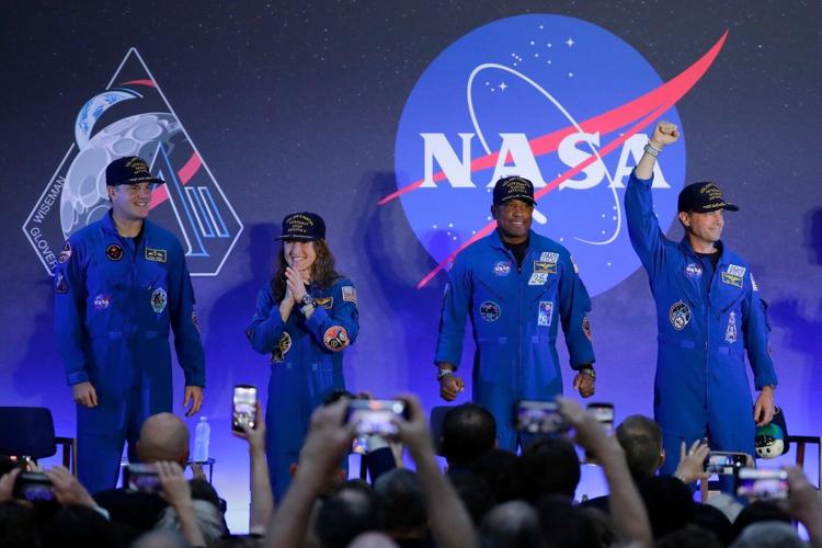 Artemis II's moon-traveling astronauts return home to cheers after a record-breaking trip