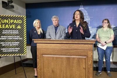 Minnesota governor signs paid family and medical leave act to give workers up to 20 weeks off