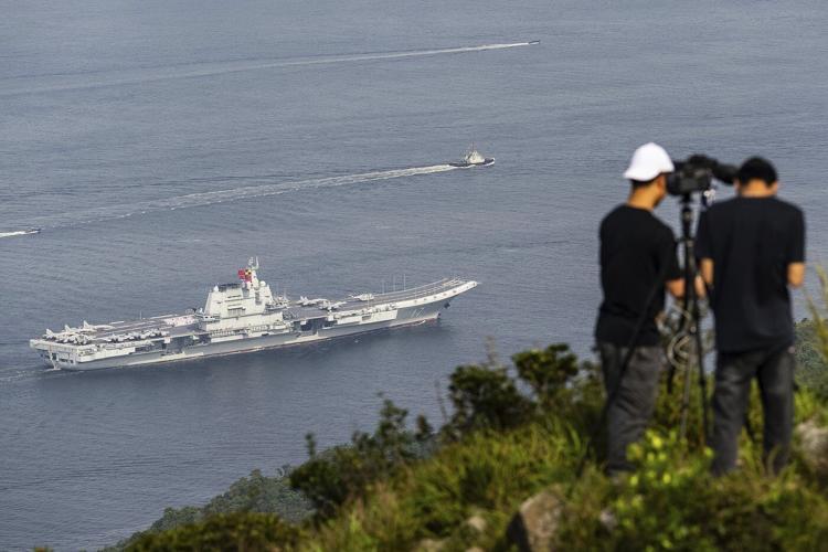 Chinese aircraft carrier sails into Hong Kong to boost patriotism