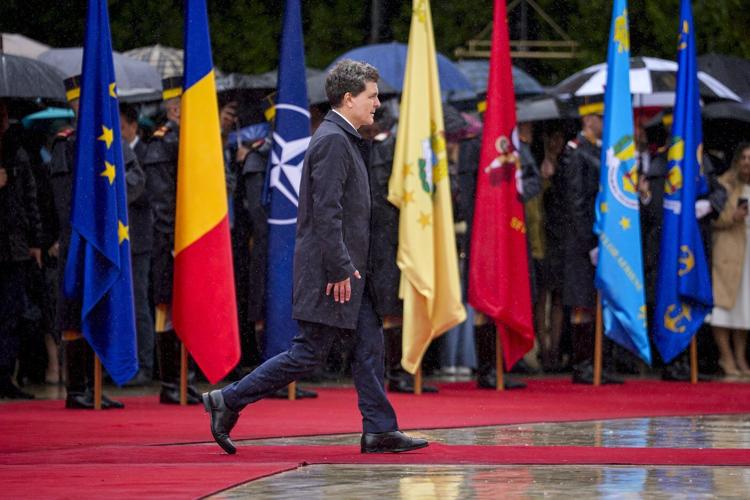 Romania's new president is sworn in as a political crisis eases, but challenges loom
