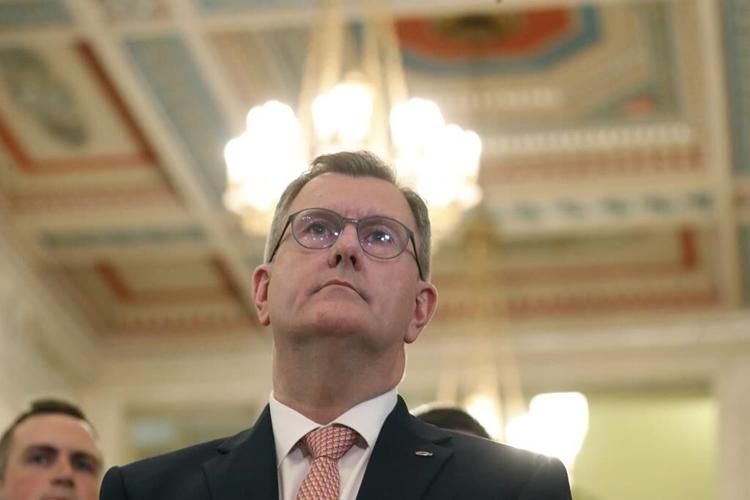 Leader of Northern Ireland's main unionist party steps down as he is charged with sexual offenses