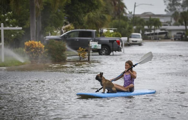 Hurricane Idalia hits Florida with 125 mph winds, flooding streets, snapping trees and cutting power