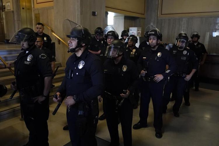 Los Angeles police face off with protesters at City Hall