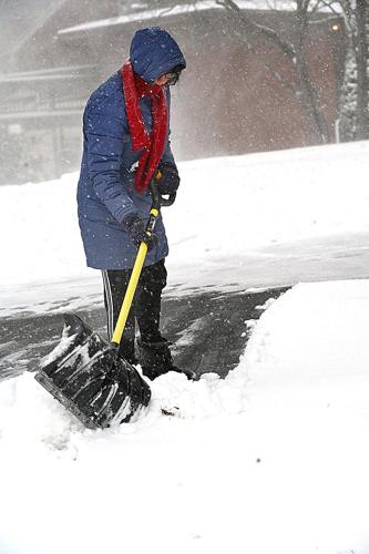 Eastern storm cuts power to tens of thousands as California braces for flooding
