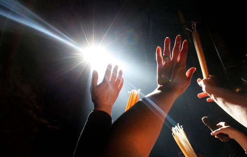 An AP reporter spends the night locked inside Jerusalem's holiest church with clergy and pilgrims