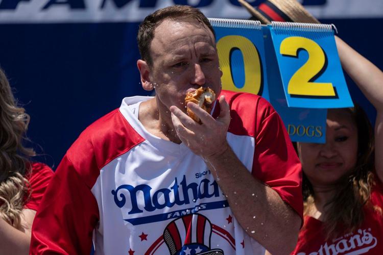 Joey Chestnut reclaims title in Nathan's Famous hot dog eating contest, wins 17th Mustard Belt