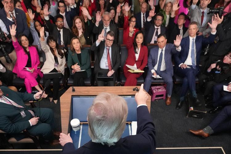 Photos of Trump's Monday, talking Iran at Easter Egg Roll and mimicking a sniper in the press room