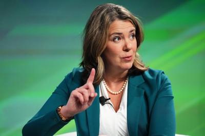 Alberta premier says politicians cannot talk to accused, but her call was OK