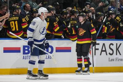 Boeser moves into tie for NHL scoring lead as Canucks beat Lightning 4-1