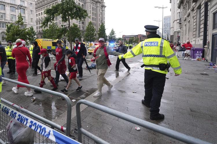 AP PHOTOS: Driver arrested after car plows into celebrating Liverpool fans