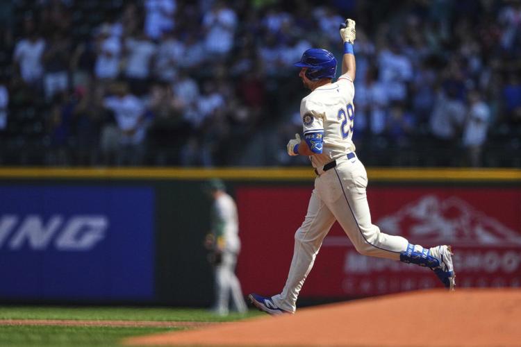 Cal Raleigh hits his 48th, 49th homers to set MLB season mark for catchers, passing Salvador Perez