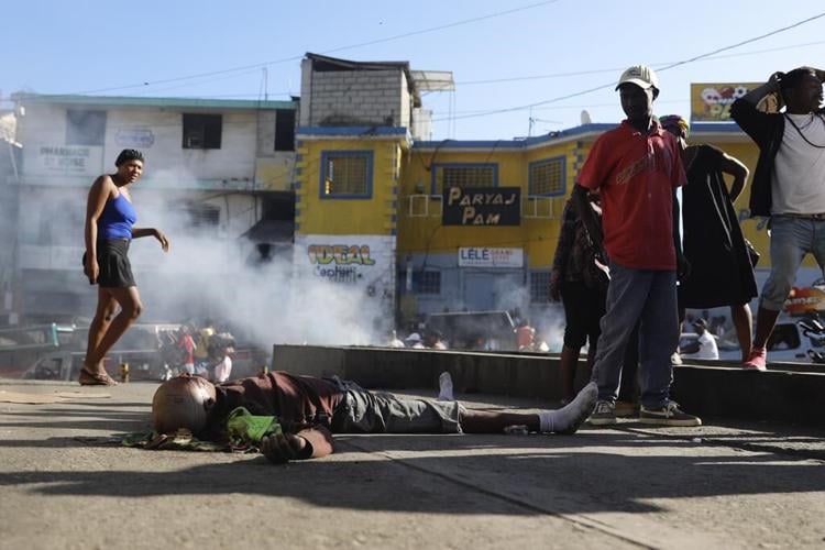 Gangs unleash new attacks on upscale areas in Haiti's capital, with at least a dozen killed nearby
