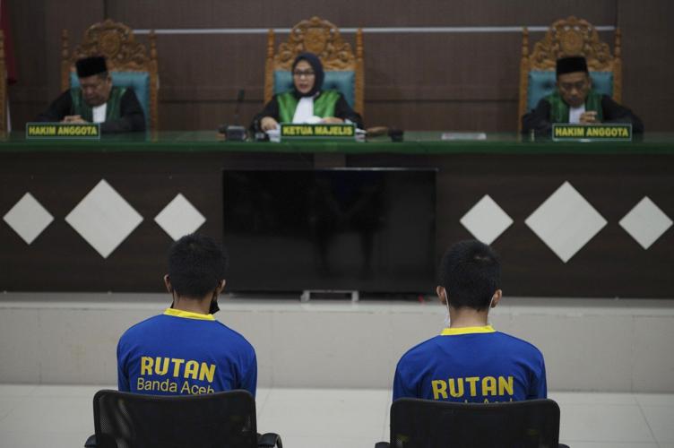 Shariah court in Indonesia sentences 2 men to up to 85 lashes for having gay sex