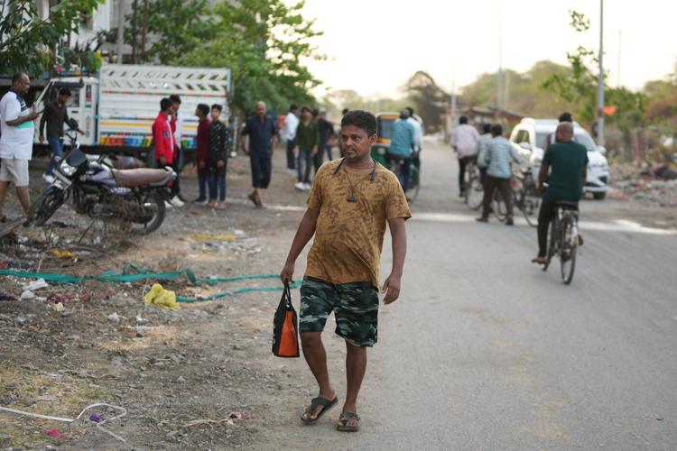 How one Indian textile worker copes with extreme heat in factory work and cramped living quarters