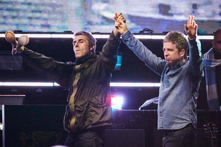 Drenched and nostalgic, Oasis marks Toronto return amid sudden downpour