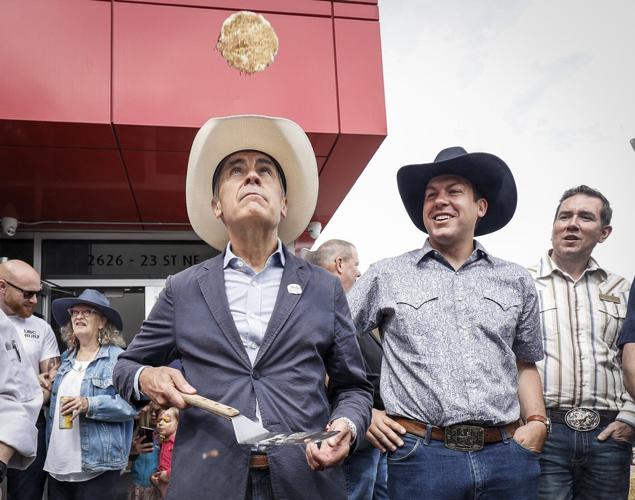 Splat: Prime Minister Carney struggles to flip perfect pancake at Calgary Stampede
