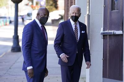 Biden welcomed back to Georgia after lying low in midterms