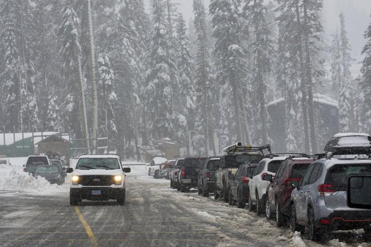 Storm dumps record rain and heavy snow on Northern California. Many in Seattle still without power