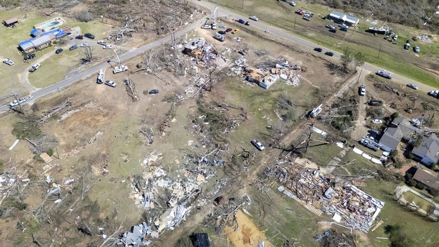 Residents pick up the pieces after devastating storms scour the US South and Midwest