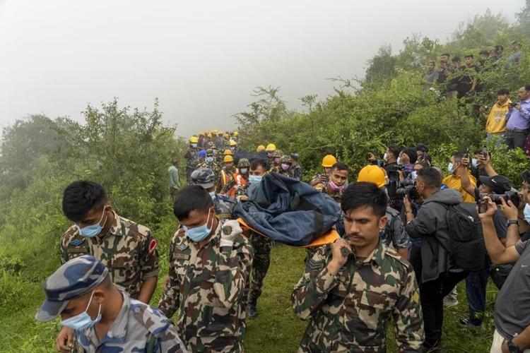 5 people killed in a helicopter crash in the mountains northwest of Nepal's capital