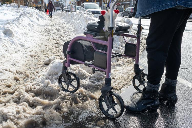 People with mobility issues struggle to navigate sidewalks as cities rush to clear snow