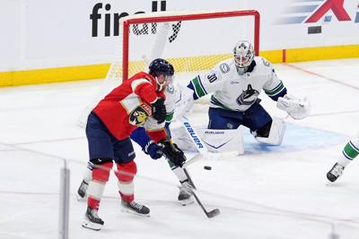 Bennett's tiebreaking goal leads Panthers past Canucks 8-5