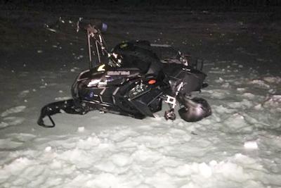 A snowmobiler who crashed into a parked Black Hawk helicopter is awarded $3 million