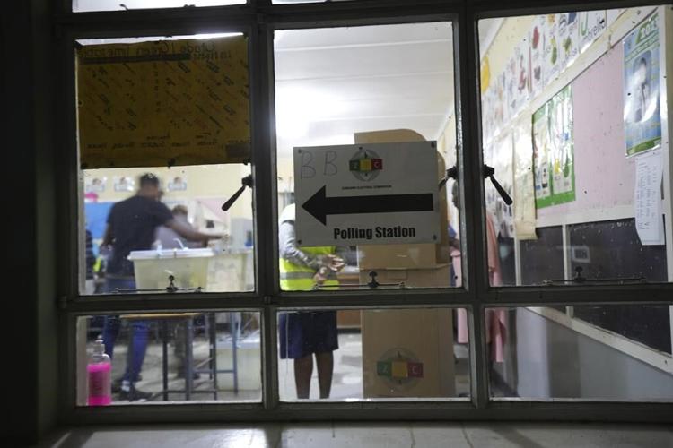 Zimbabwe's election extends to a second day after long ballot delays. Some slept at polling stations