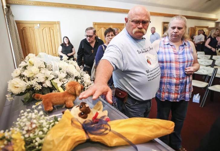 Woman charged in death of boy found in suitcase seeks change of Indiana venue