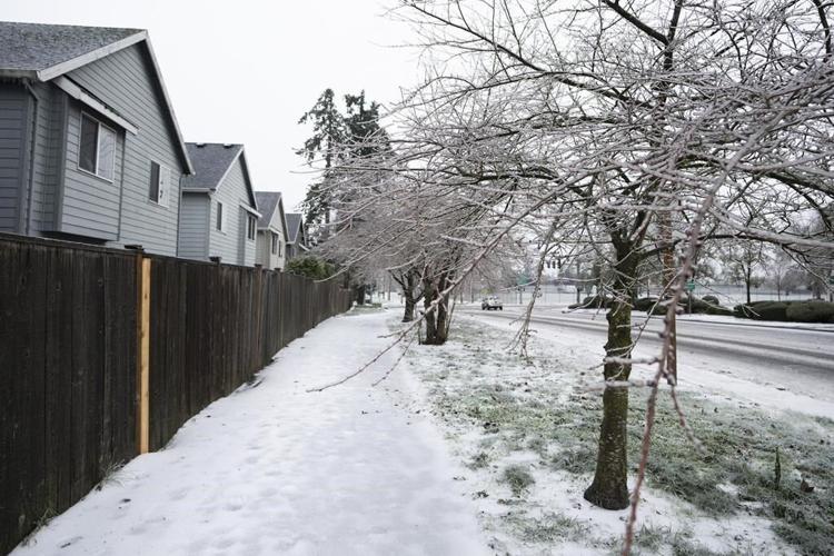 Power line falls on car during Oregon ice storm, killing 3 and hurting a baby, authorities say
