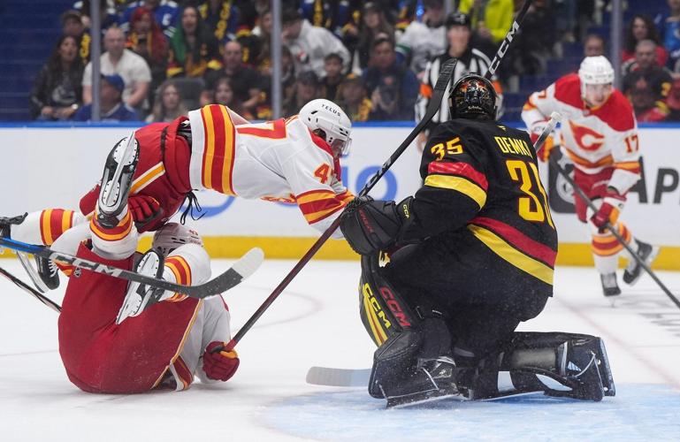 Chytil scores two, Vancouver Canucks dump Calgary Flames 5-1 in season opener