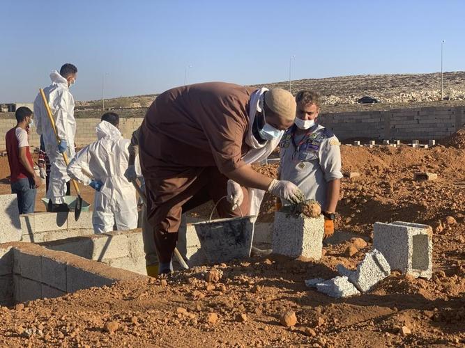 Searchers look for more than 10,000 missing in flooded Libyan city where death toll eclipsed 11,000
